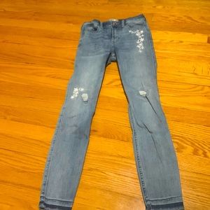 Size 11/12 flowers sewn on has rips